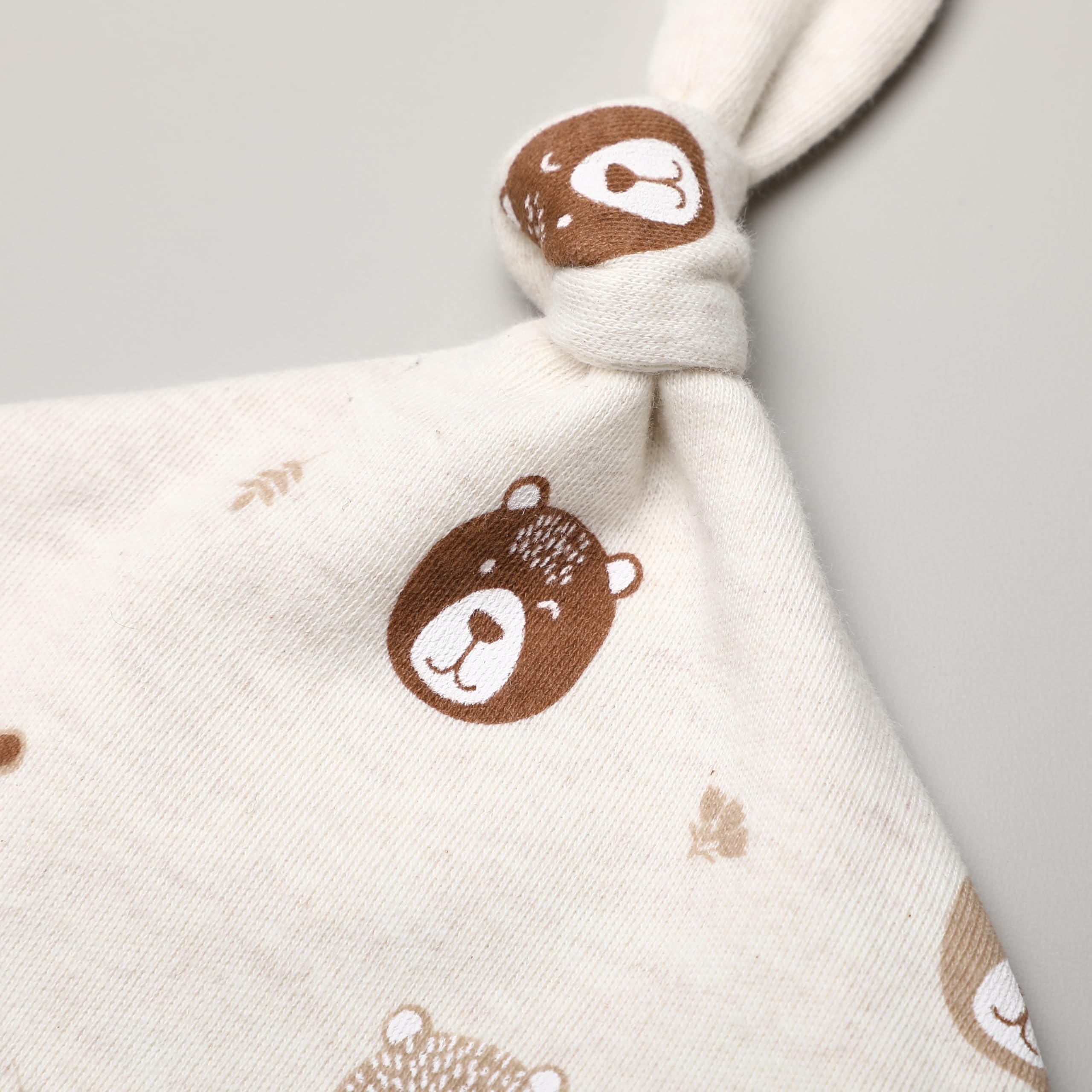 Owlivia knot hat in beige for gentle, breathable comfort.