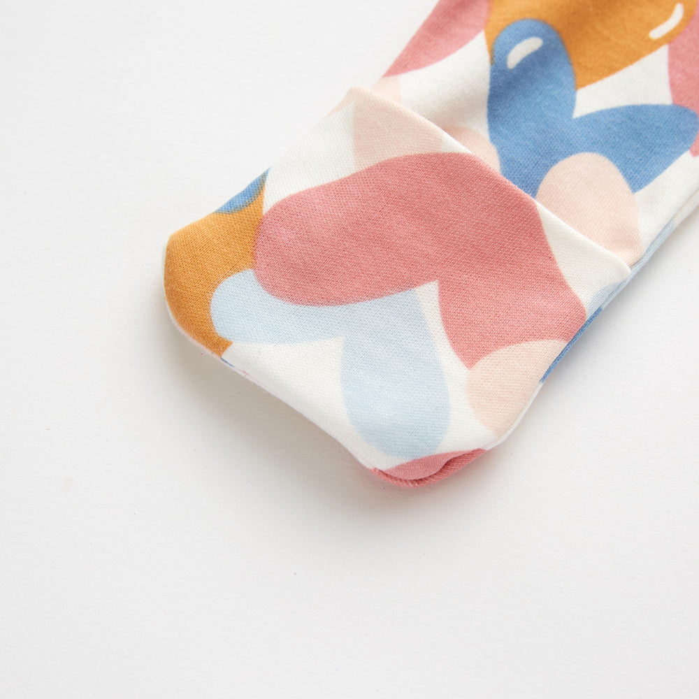 Owlivia neck-to-toe zip with tab prevents rubbing on delicate skin