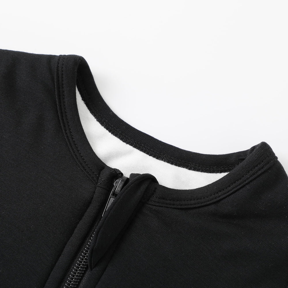 Owlivia sleep sack features 2-way zipper for easy diaper changes.