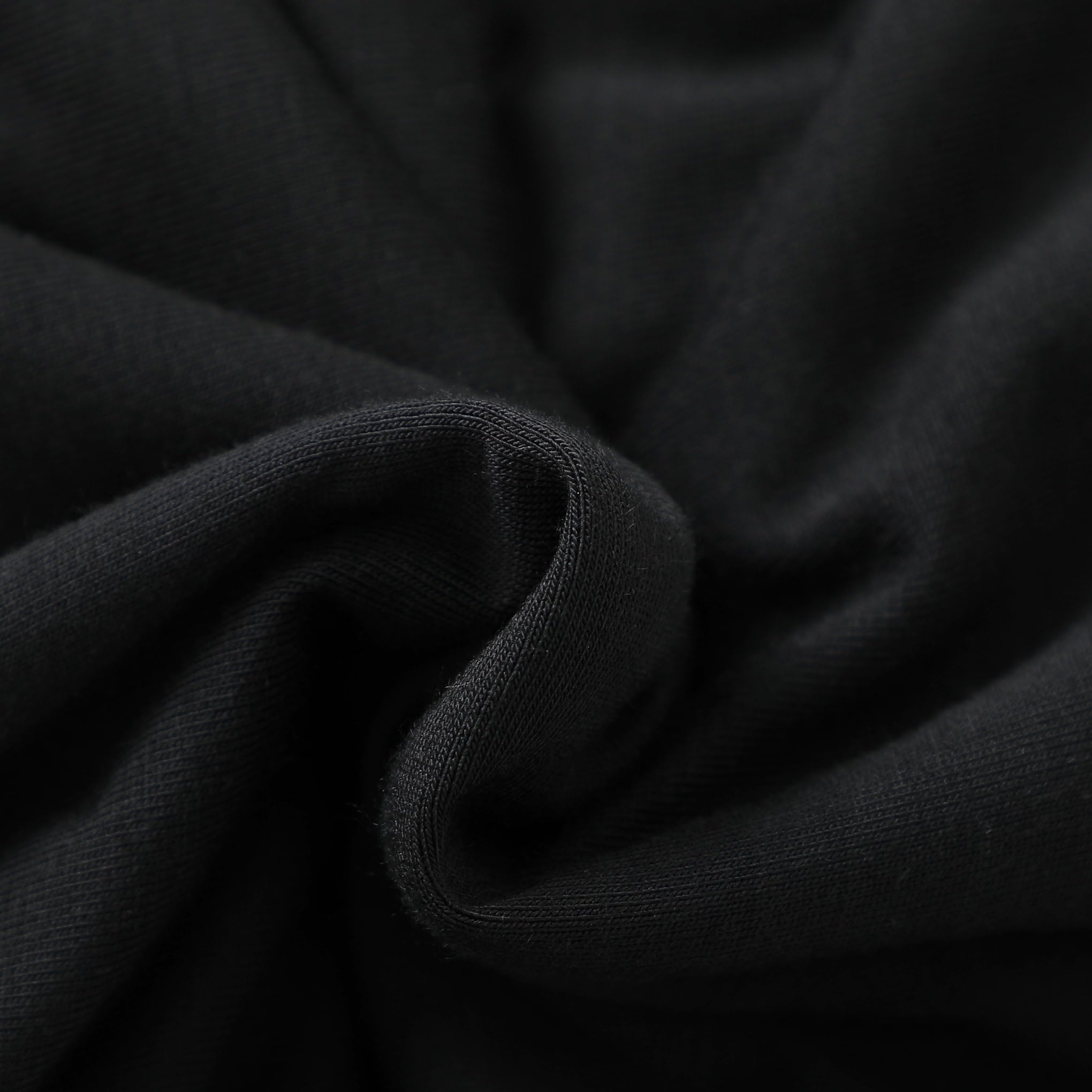 Baby wears Owlivia sleep sack in black during calm bedtime routine.