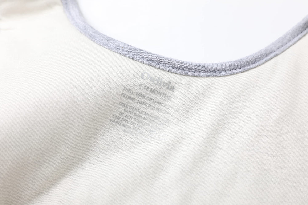 Owlivia sleep sack layered-material close-up shows breathable organic cotton and soft quilting.