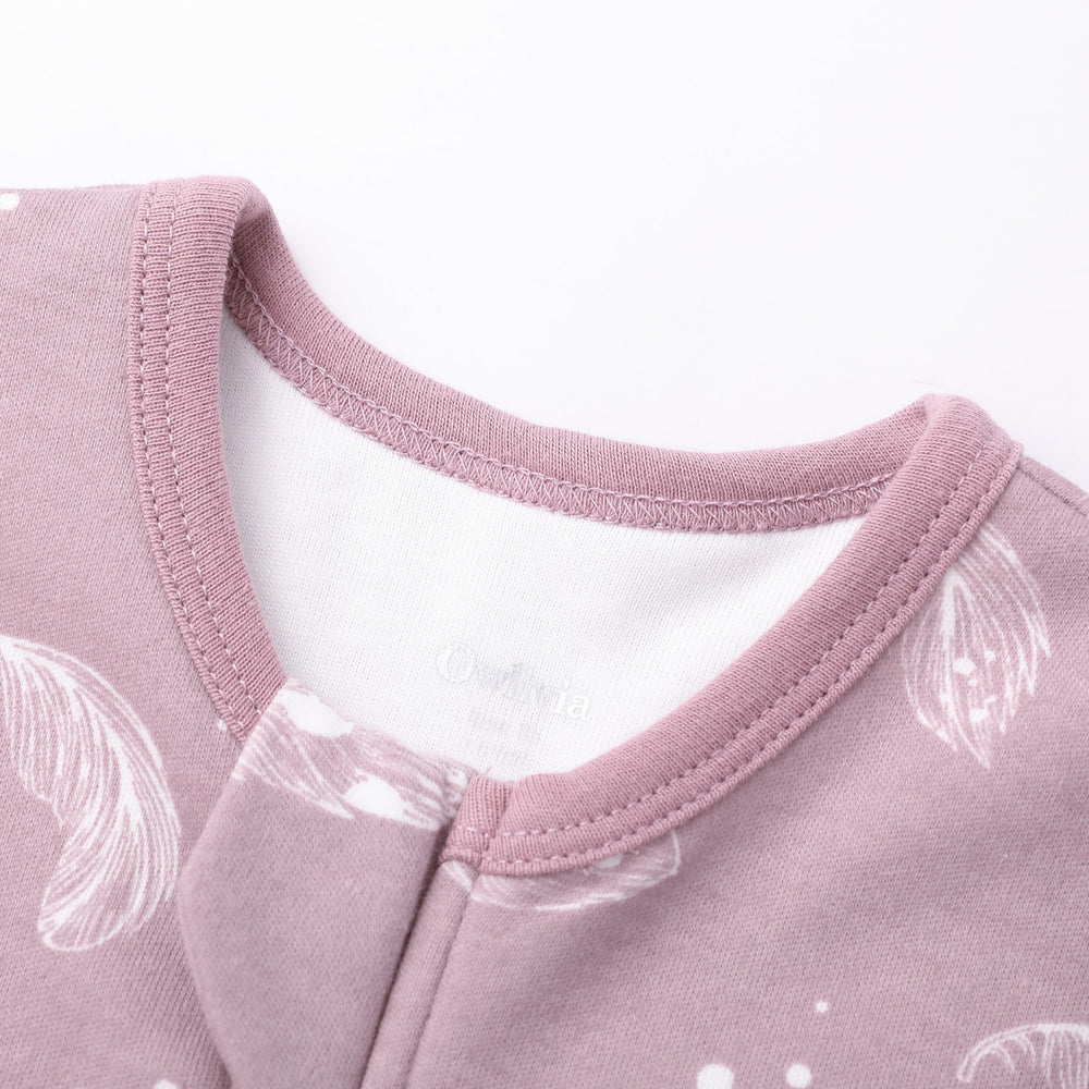 Owlivia vibrant mauve feather pattern highlights bedtime appeal for kids.