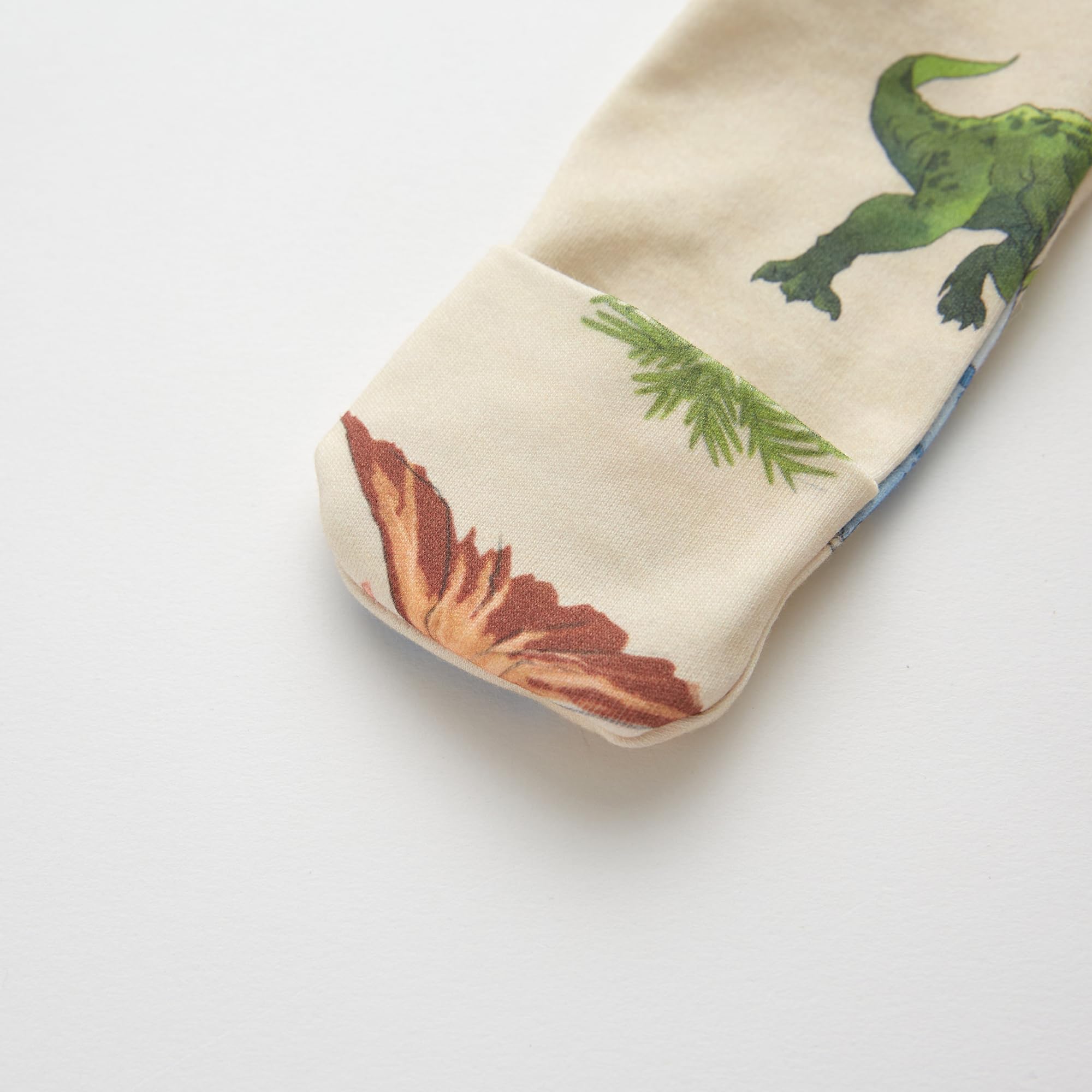 Owlivia zip-closure-neck-toe-tab-protection keeps baby comfortable during quick diaper changes