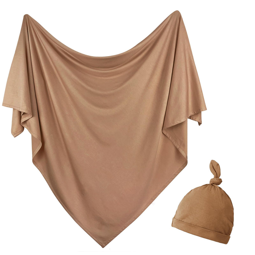 OWLOWLA newborn swaddle blanket copper close-up highlights soft jersey knit comfort.