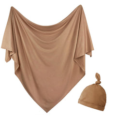 OWLOWLA newborn swaddle blanket copper close-up highlights soft jersey knit comfort.