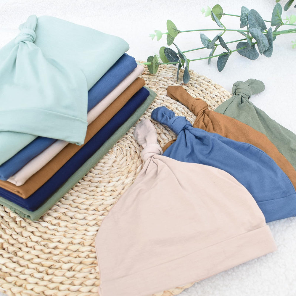 OWLOWLA newborn swaddle olive in car seat demonstrates versatile stroller-ready comfort.