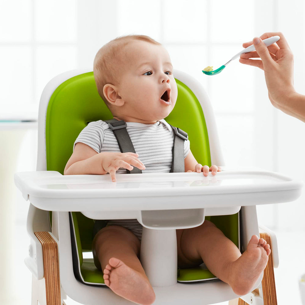 OXO Tot teal spoon in use during baby mealtime with soft solids