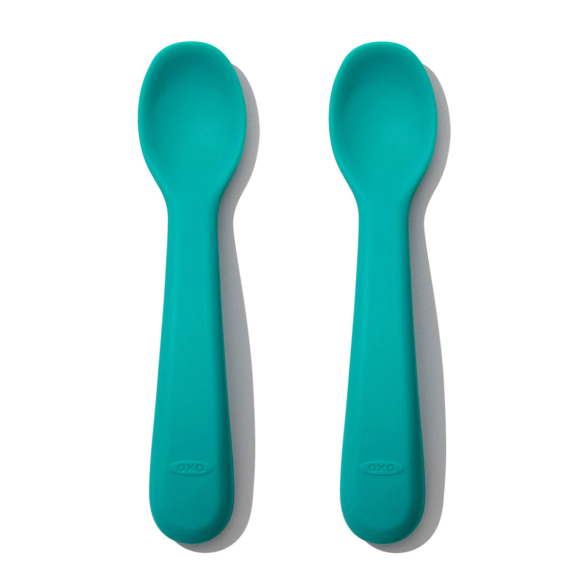 OXO Tot silicone spoons teal close-up, gentle on gums for self-feeding