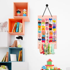 PACMAXI bow organizer on wall demonstrates easy access to headbands and clips