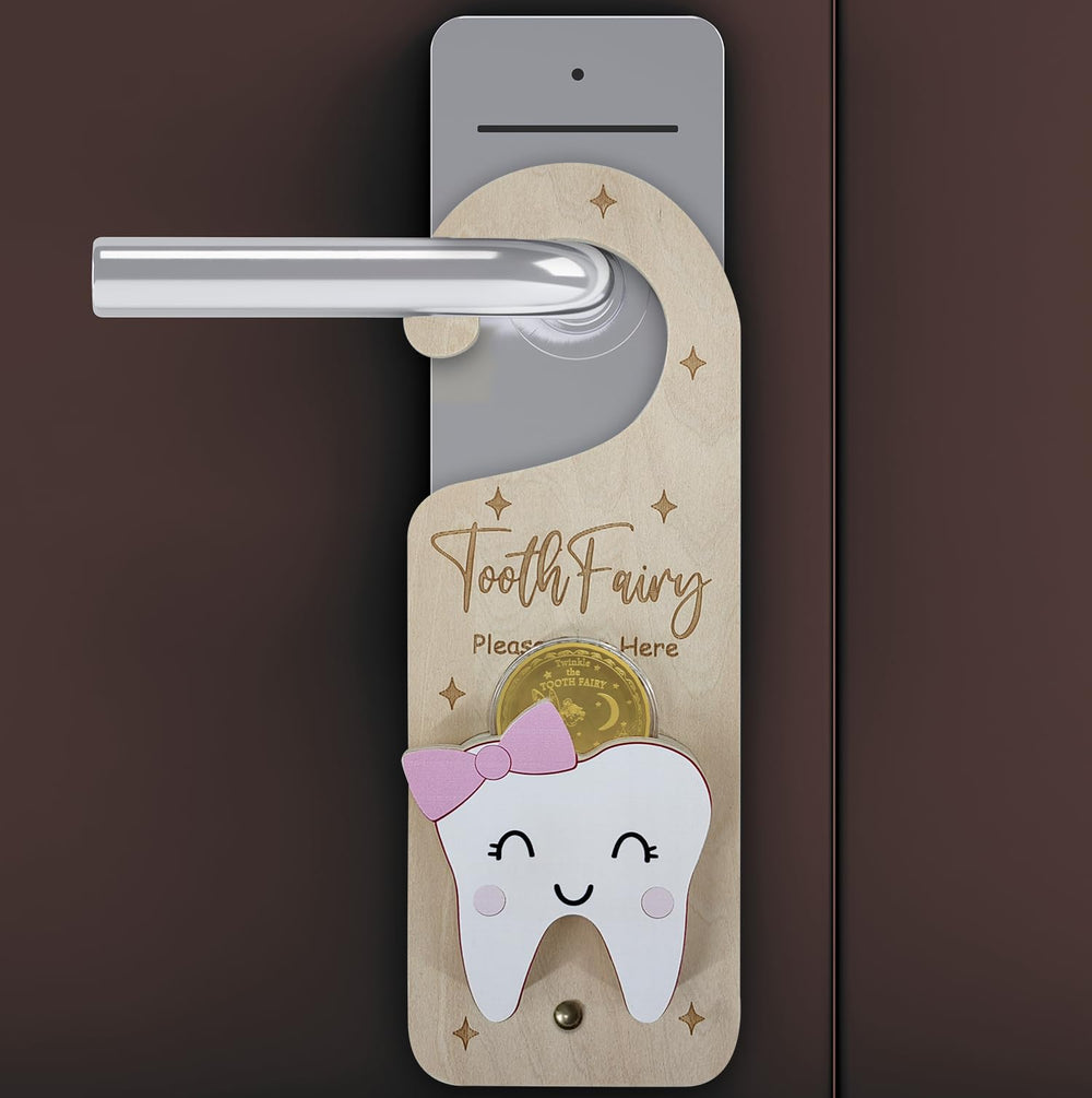 PAMBO door-handle ornament featuring a tooth fairy motif on a pink wooden hanger.