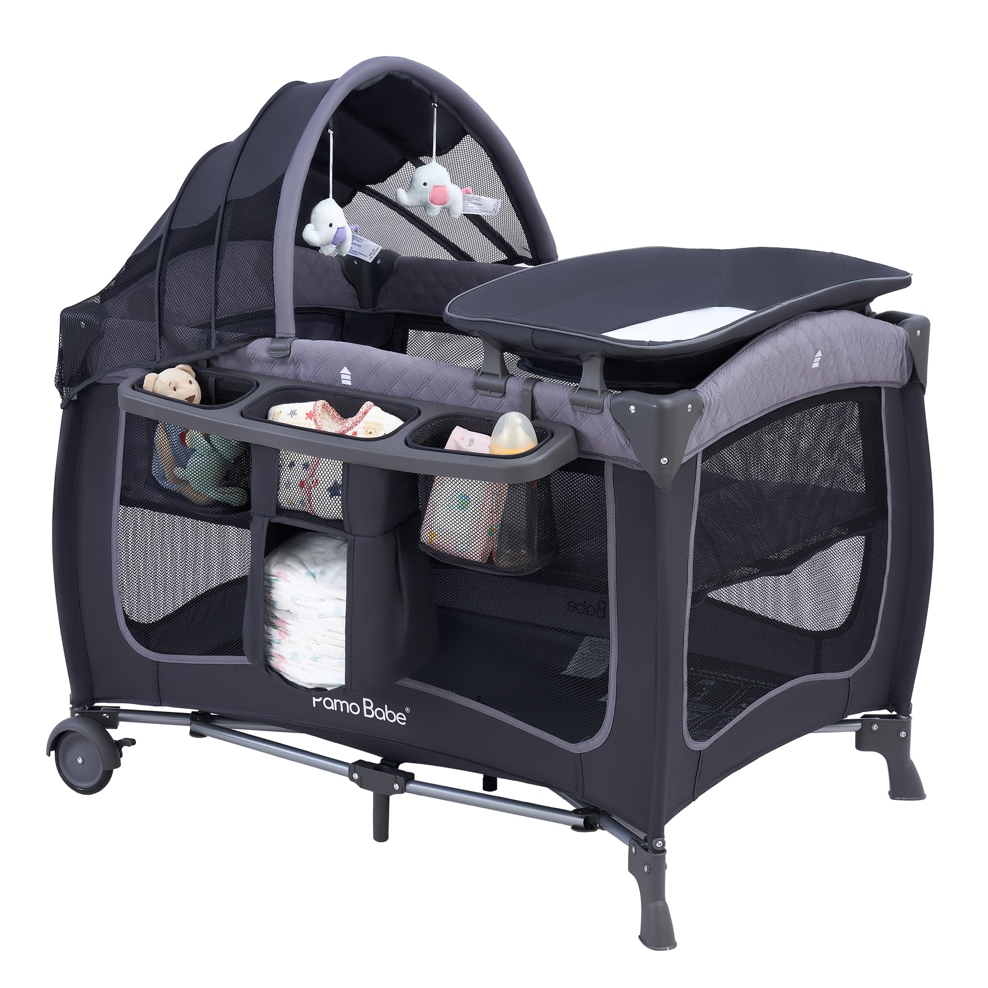 Pamo Babe canopy assembly view on the playard shows quick setup for new parents.