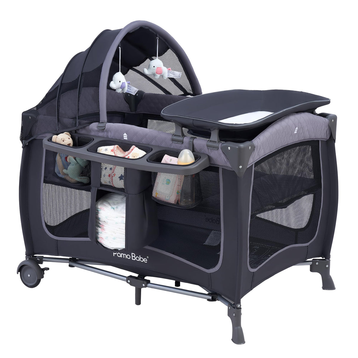 Pamo Babe canopy assembly view on the playard shows quick setup for new parents.
