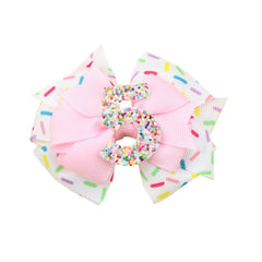 PandaEar birthday bow with pink sprinkles for festive photos