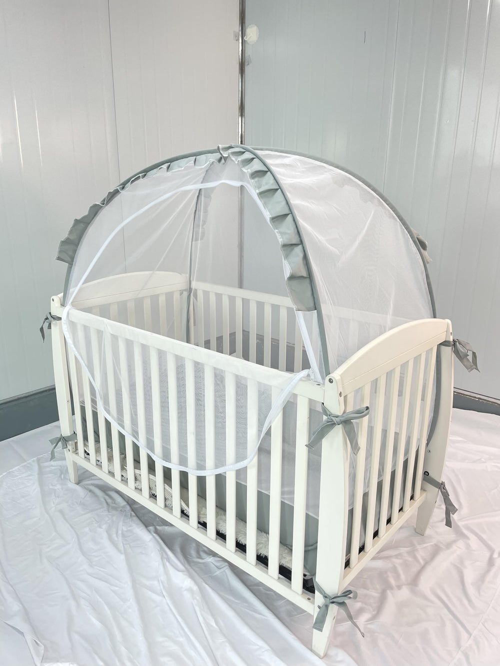PandaEar crib tent straps secure tent to standard cribs.