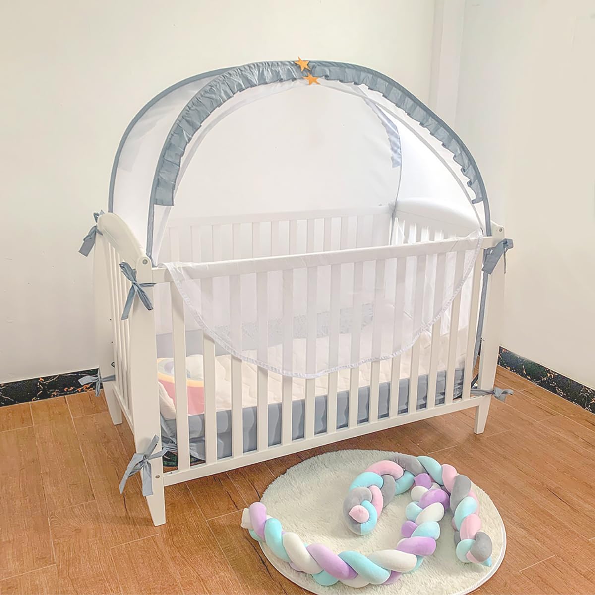 PandaEar crib tent inside crib demonstrates secure fit and airflow.