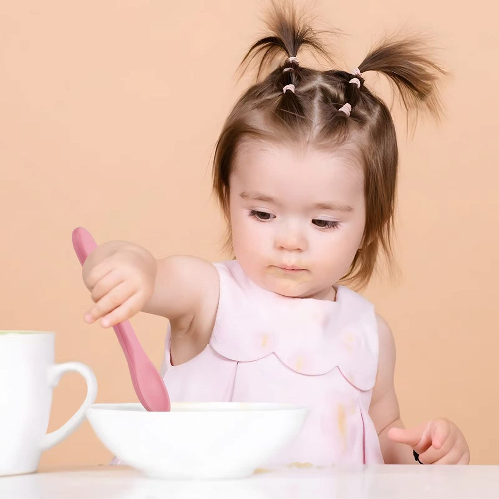 PandaEar self-feeding utensils with long, arched handles for easy grip.