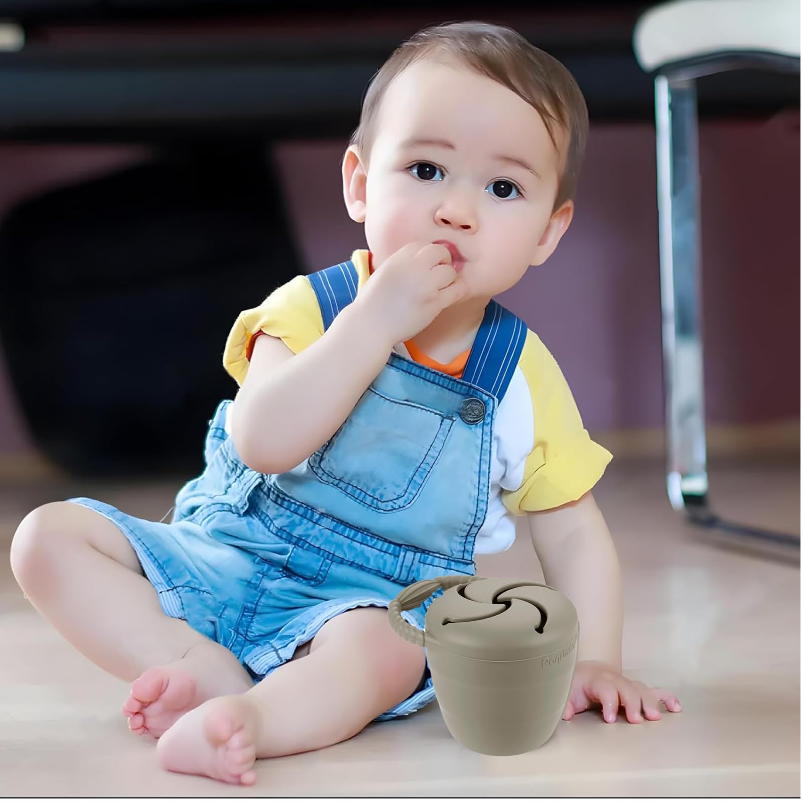 PandaEar spill-proof snack catcher during play, preventing messes.