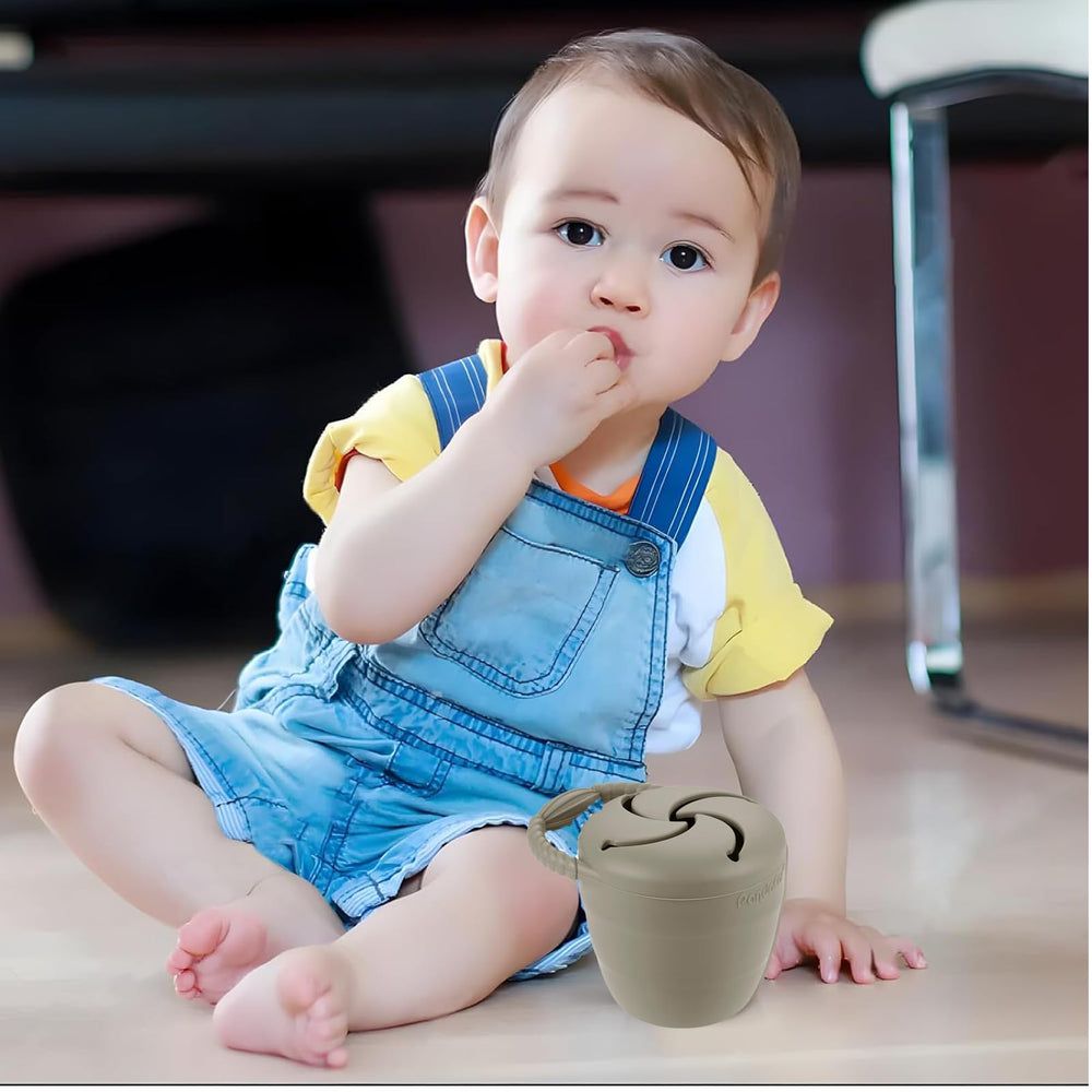 PandaEar spill-proof snack catcher during play, preventing messes.