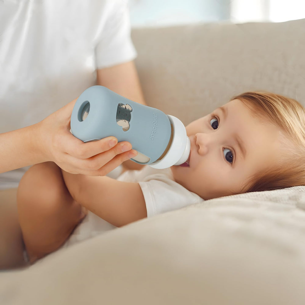 PandaEar silicone sleeves on bottle side view improve grip and protection during feeding.
