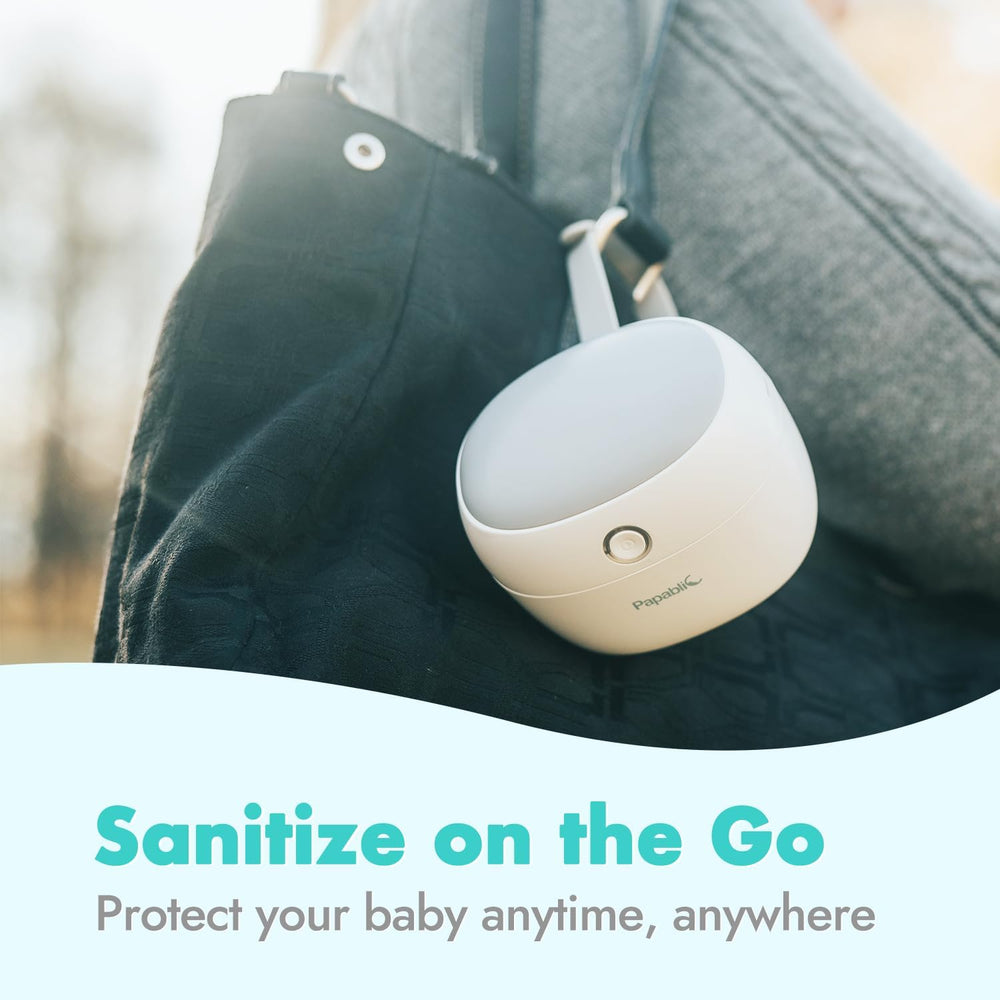 Papablic pacifier sanitizer EPA safety certification visible on device.