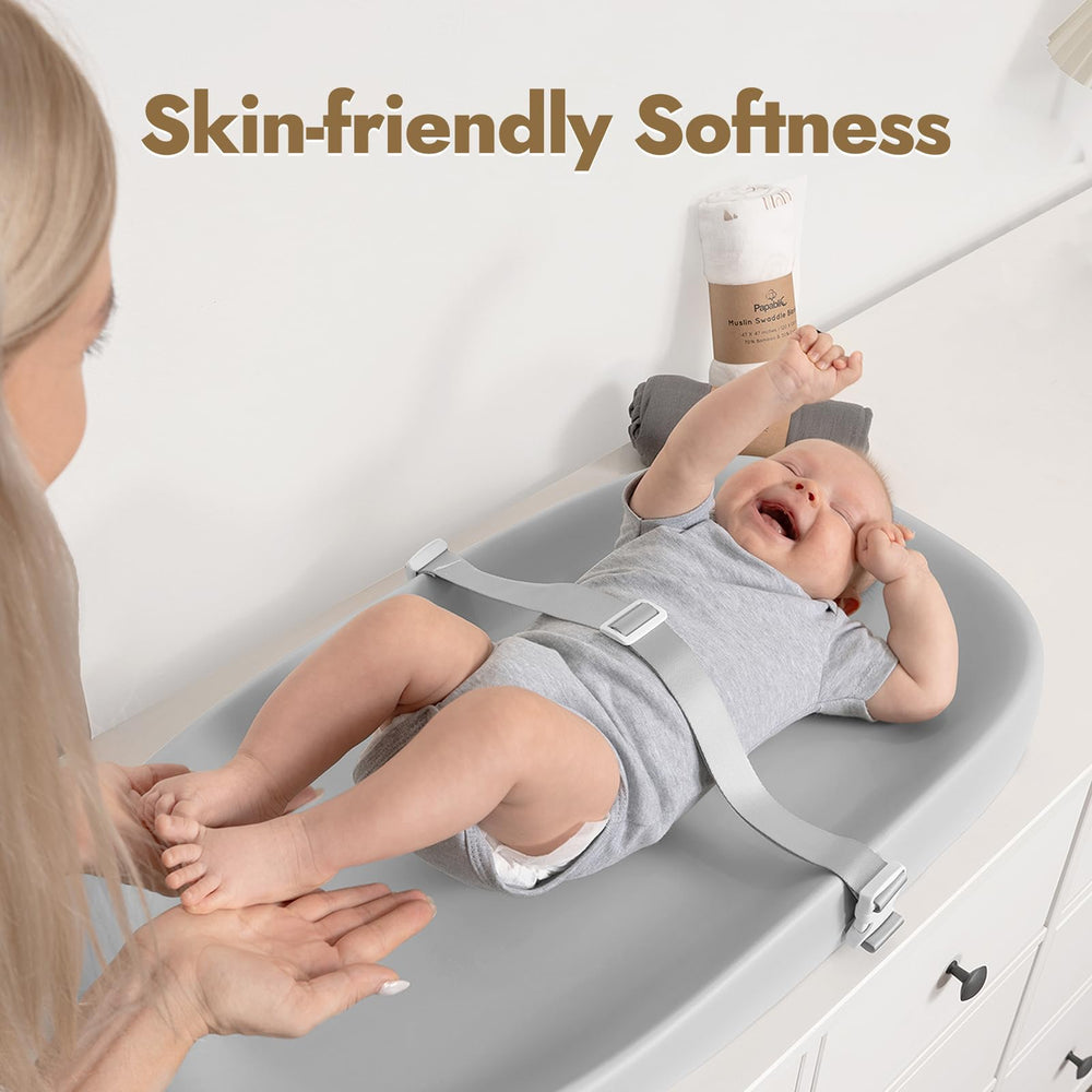 Papablic wipeable changing pad in use on a dresser with baby