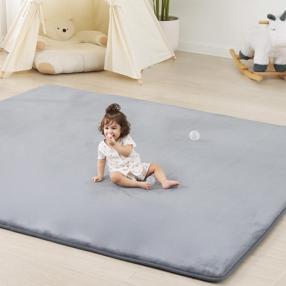 PaPaMat 1.3-inch thick baby floor mat offers cushioned support for tummy time and crawling.