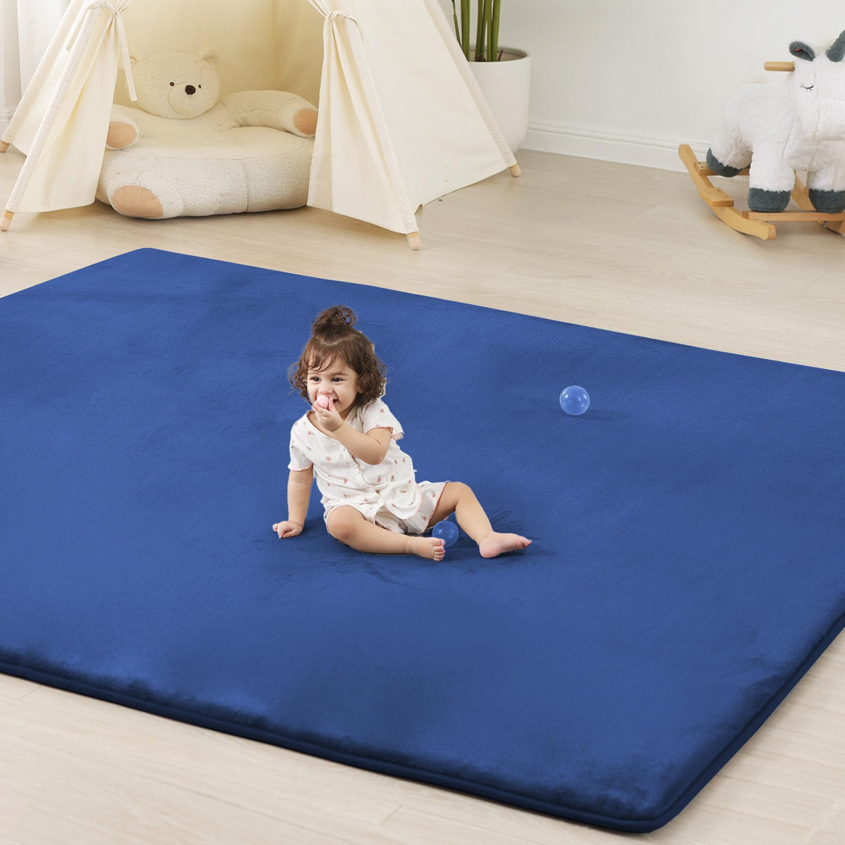 PaPaMat thick foam blue close-up—soft cushioning for tummy time and crawling sessions.
