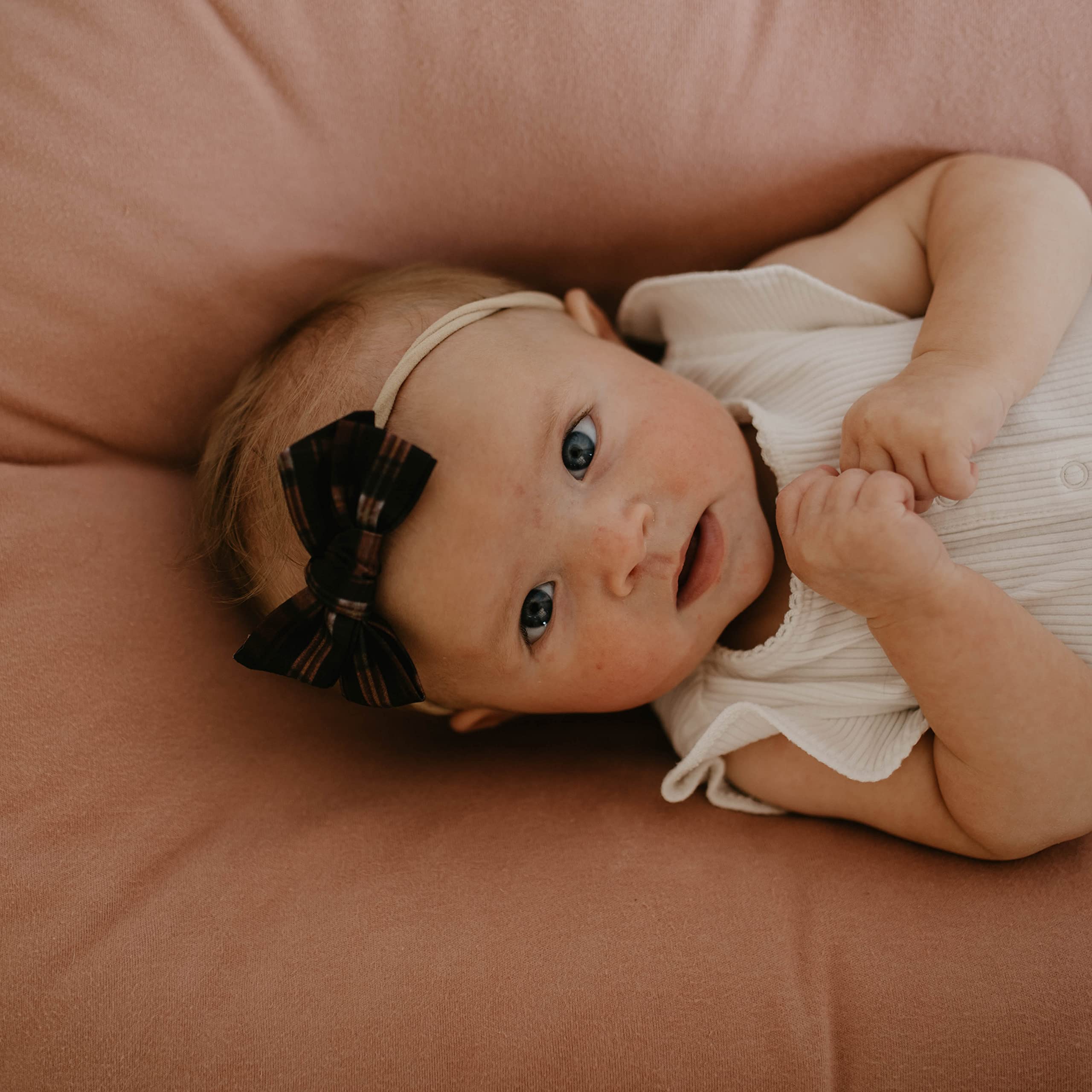 Parker Baby Co. The Anne Set floral bow adds charm to photos.