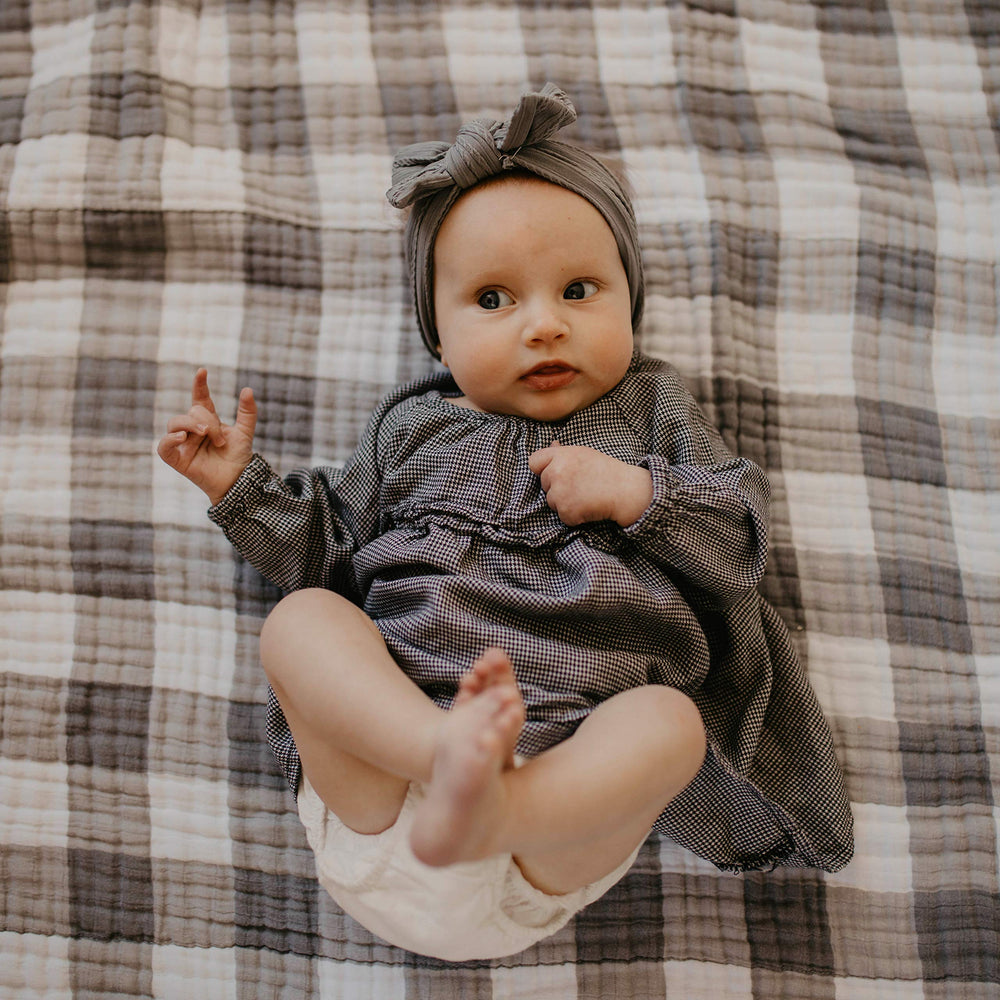 Parker Baby Co. headbands stay in place during play without slipping.