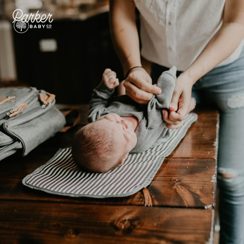 Parker Baby Co changing-pad-in-use-on-surface on a bench or table