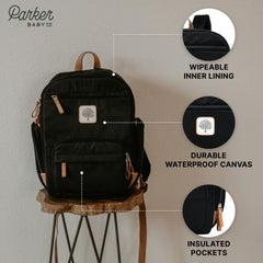 Parker Baby Co. diaper backpack insulated pockets image demonstrates temperature-friendly feeding moments.