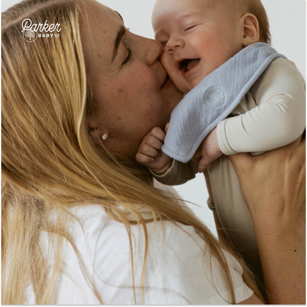 Parker Baby Co muslin bandana bibs on a baby demonstrating drool absorption.