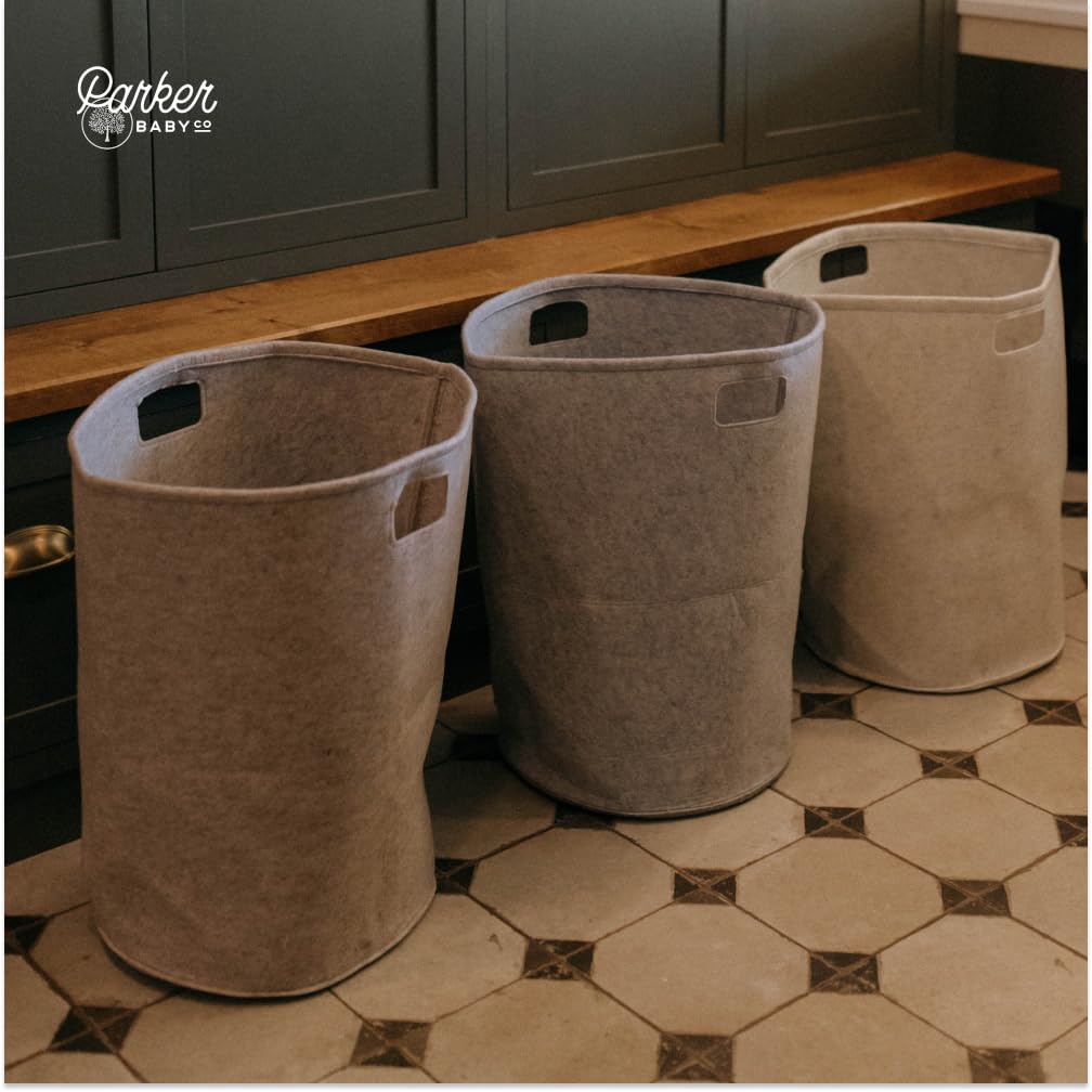 Parker Baby Co. gray hamper paired with felt diaper caddy for cohesive organization.