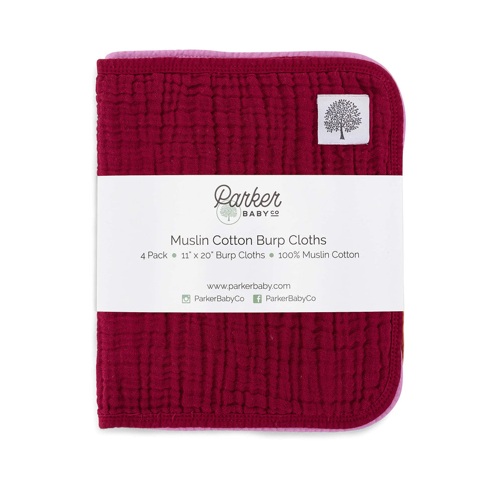Parker Baby Muslin Burp Cloths four-color bundle in diaper bag.