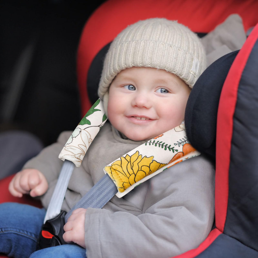 Pea Pod baby car seat strap cover installation makes stroller use quick and easy.