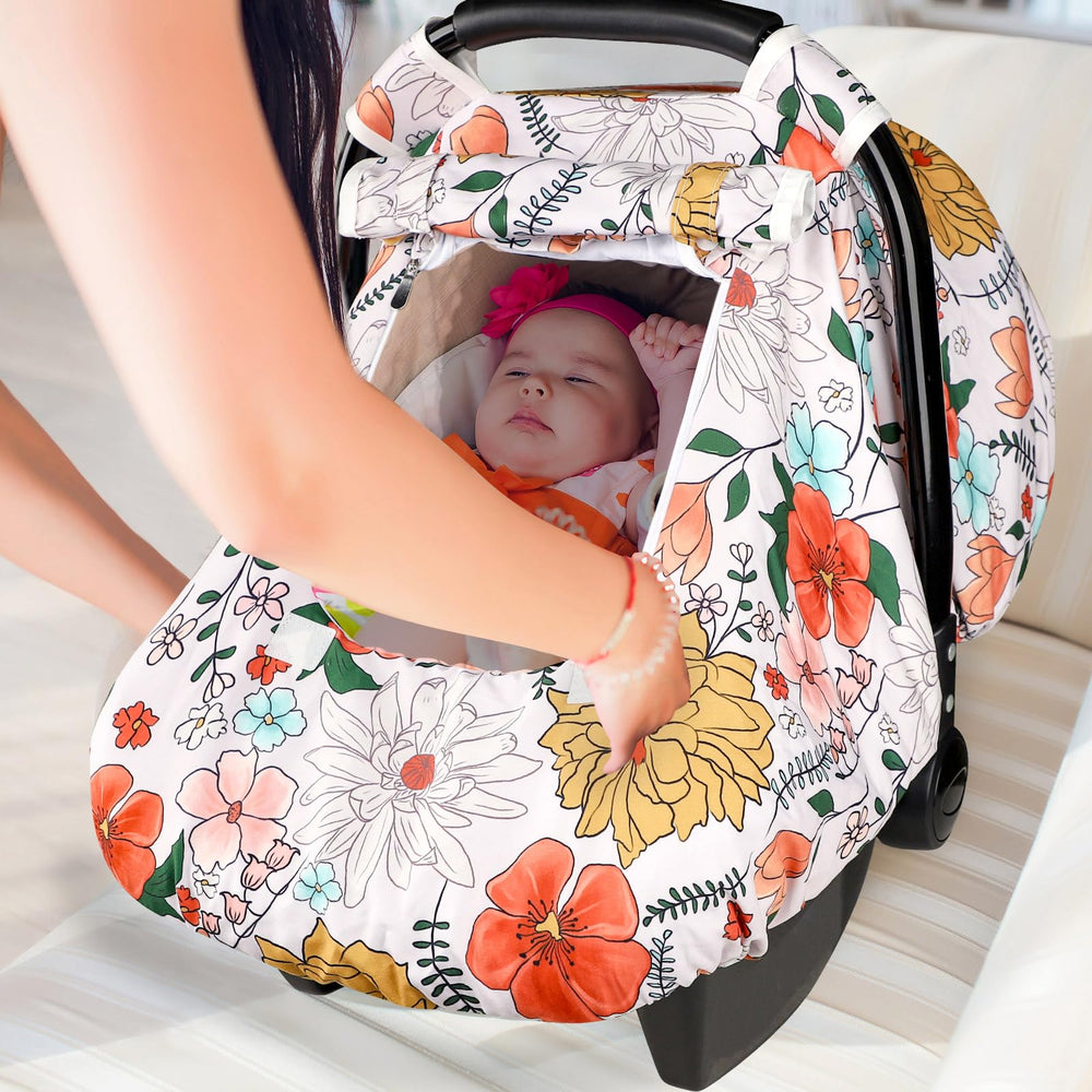 Pea Pod car seat cover elastic band keeps the cover securely in place.