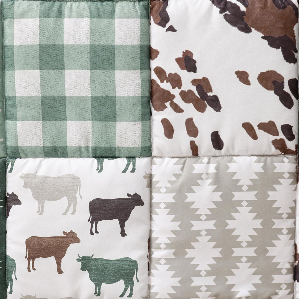 The Peanutshell pattern detail close-up showcases cow prints and patchwork