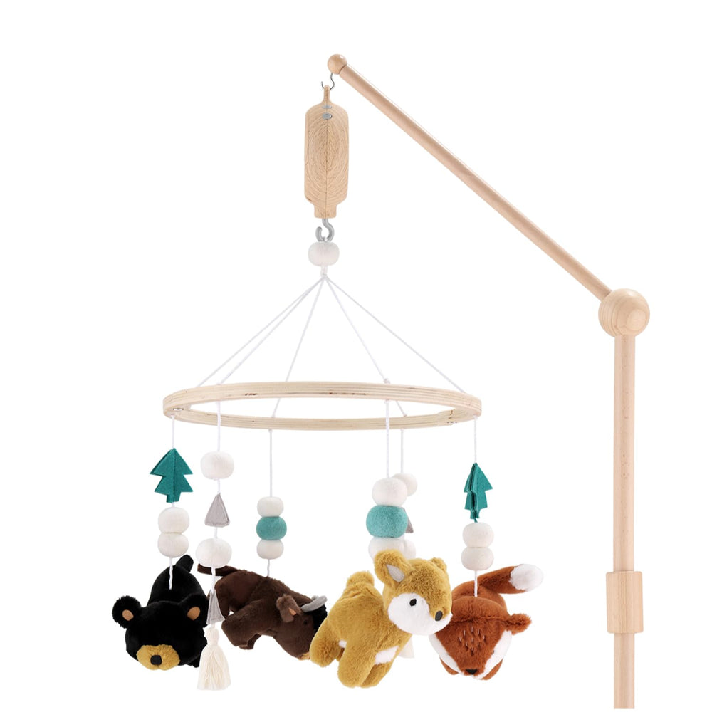 The Peanutshell Crib Mobile with wooden forest animals enhances visual engagement.