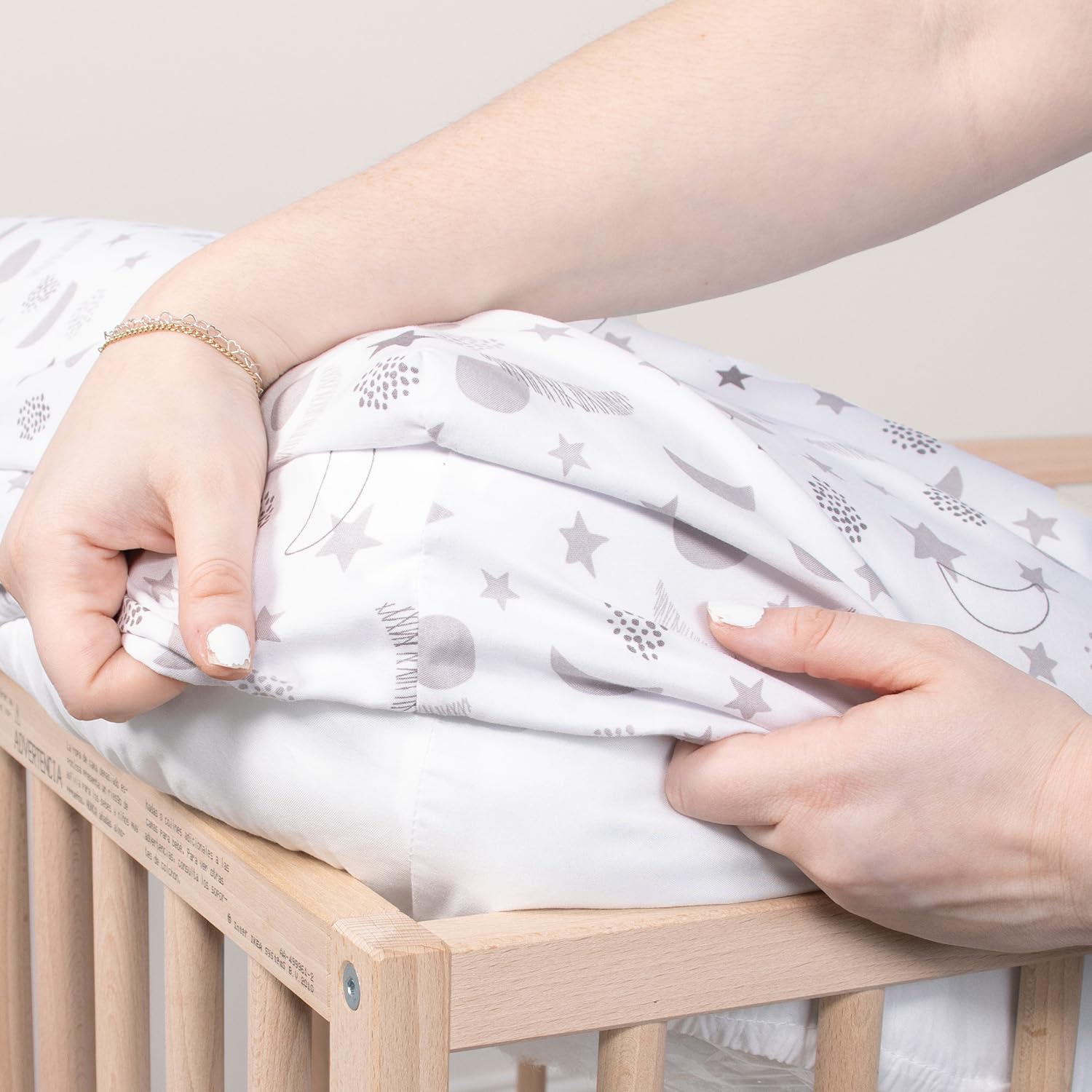 Celestial moon and stars design complements nursery decor while staying practical and easy to care for.