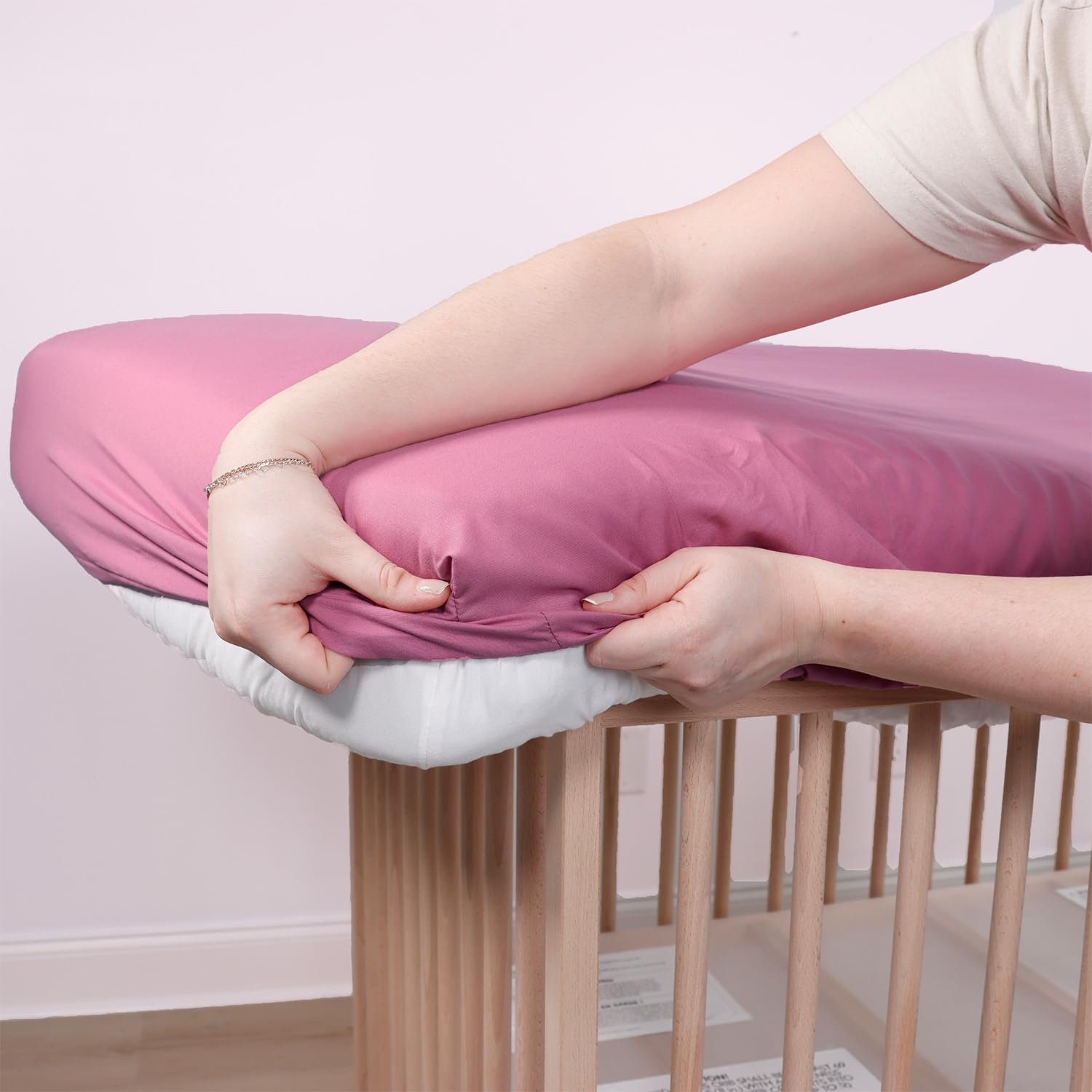 The Peanutshell baby girl nursery decor with soft pink floral motif.