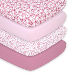 The Peanutshell daisy crib sheet pack—soft pink floral print for gentle baby naps.