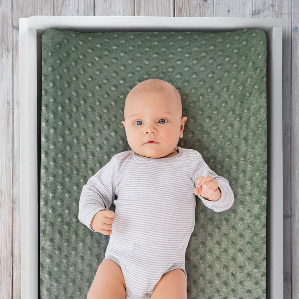 The Peanutshell cover's center buttonhole supports strap use during diaper changes.
