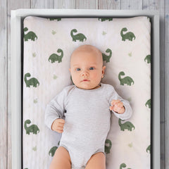The Peanutshell dinosaur changing pad cover features elastic bottom band for secure fit.