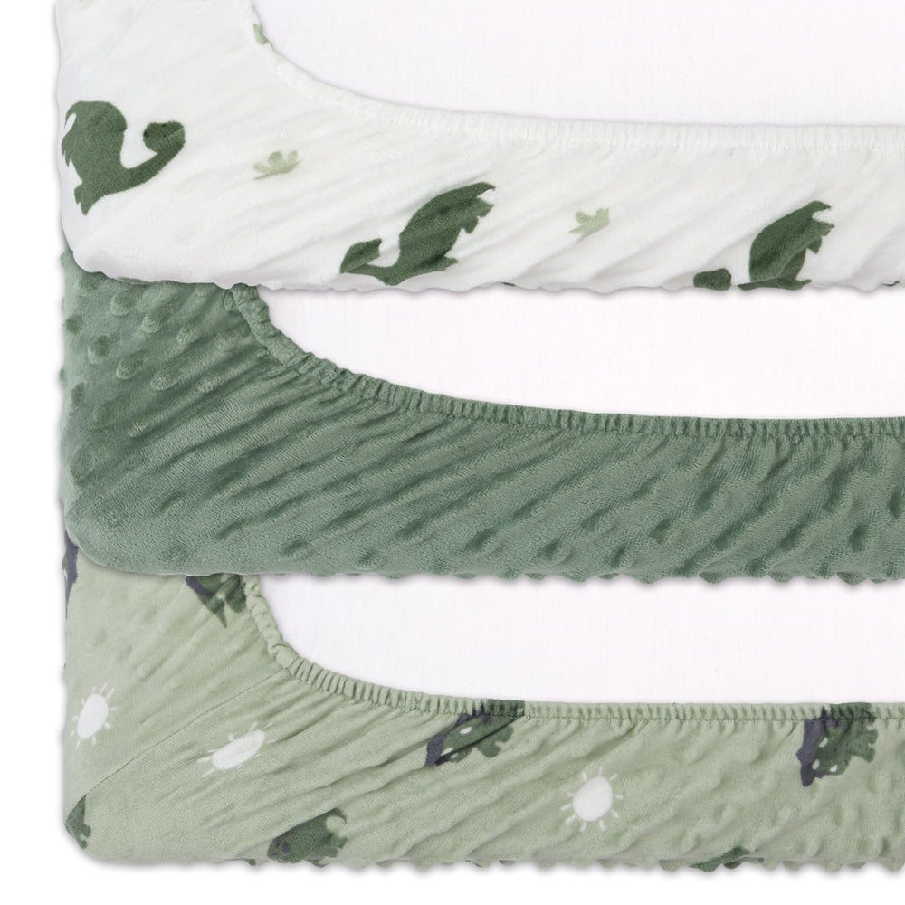 The Peanutshell dinosaur nursery decor coordinates sage green with other baby items.
