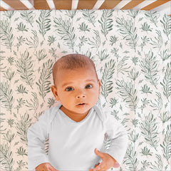 The Peanutshell forest-theme bed skirt creates a complete coordinated nursery look.