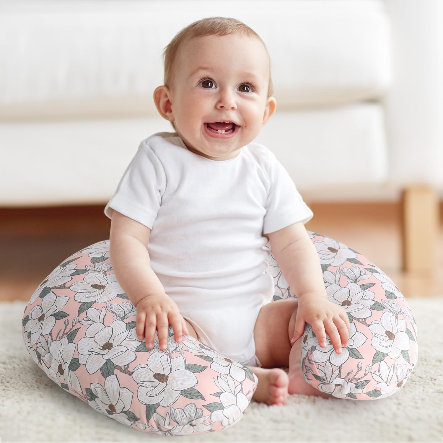 The Peanutshell nursing pillow cover supports tummy time and helps baby gain control.
