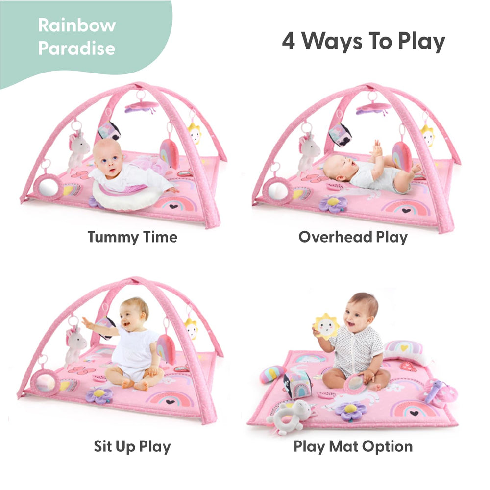 The Peanutshell Rainbow Paradise play gym with hanging toys encourages reach and grasp.