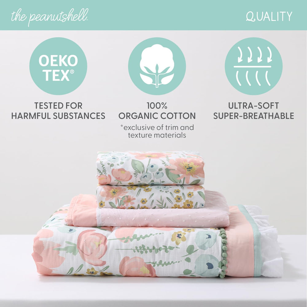 The Peanutshell Wildflower dust ruffle bed skirt demonstrates coordinated nursery styling and tidiness.