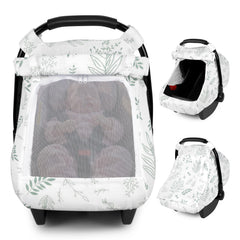 Pea Pod Muslin Car Seat Cover leaf-pattern fabric closeup demonstrates breathable, gentle cotton texture.