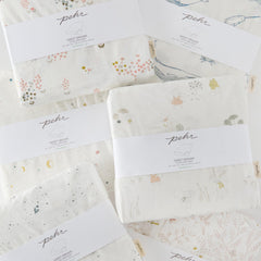 PEHR Life Aquatic crib sheet ships in sustainable packaging for mindful living.
